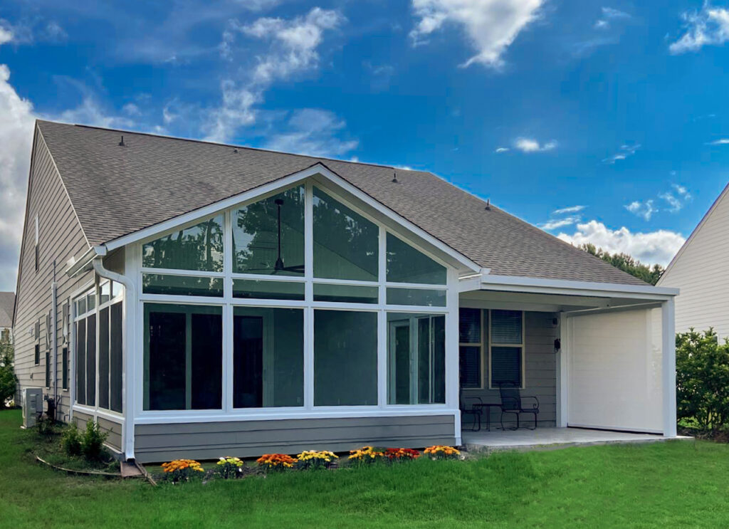 Cathredral Sunroom with fixed Pergola and Motorized Retractable Screens built to last and withstand Midwest winters