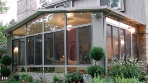 Sunroom with glass windows is temperature controlled for year round comfort and use