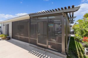 Screen room with Skyview Roof Panels combo'd with a stunning pergola patio cover