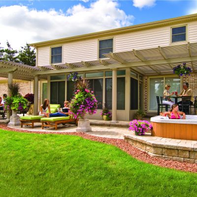 classic pergola outside with hottub sitting area PRG Classic Fixed Attch Vene Outsd Day Ss 0003 WideAngle